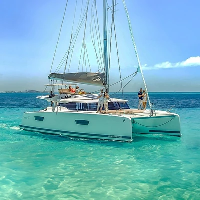 Isla Mujeres Privilege: Luxury Catamaran, VIP Club and Downtown with Transportation